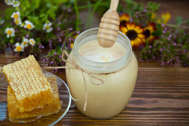 Delicious delicious honey in a jar on the table